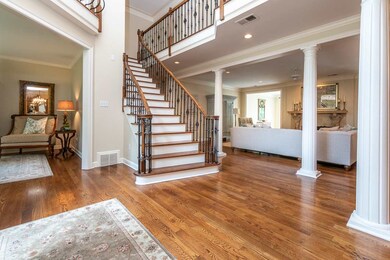 Custom staircase wood handrails and beautiful iron