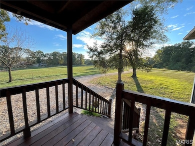 Wooden deck featuring a yard