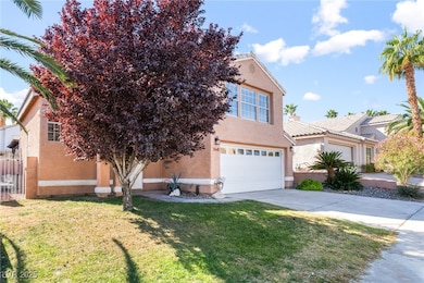 Obstructed view of property with a front lawn, stucco siding, a garage, and concrete driveway
