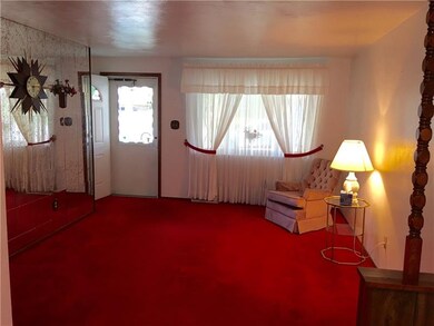 Living room front entrance. Large window for lots 