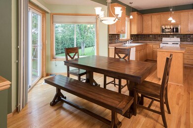 Informal dining space is bright with patio door le