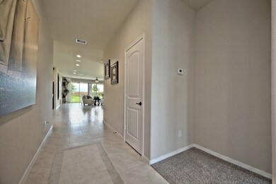 Welcome Home! Stunning Large Tile Floors are through the home with Lush Carpeting in all of the bedrooms!**Photo is of the Bayfield Plan and is of the Model Home and the Actual Property Not Photographed.**