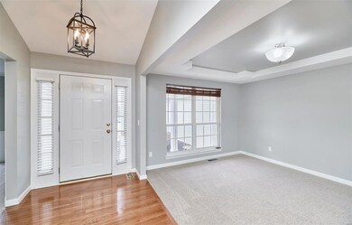 Entry foyer with hardwood flooring