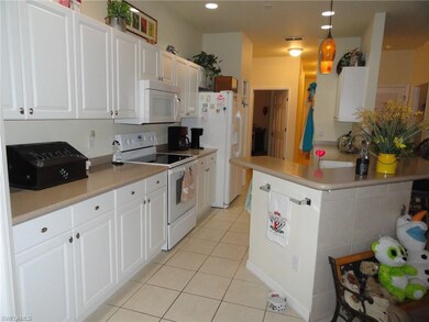 Awesome Kitchen, all appliances, Corian counter tops, Pantry, & lots of cabinetry.