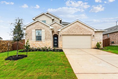 Traditional-style house featuring a garage, drive