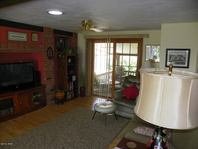 Part of living room to back deck