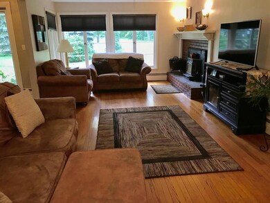 Living room with wood burning fireplace