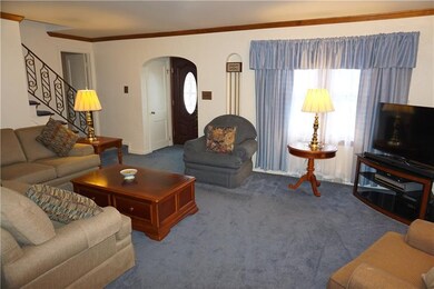 The spacious  19x14 Living Room featuring crown mo