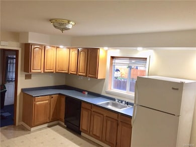 Lower kitchen with appliances and washer and dryer