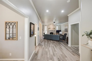 Formal dining to the L and office on the R. Updated flooring throughout.