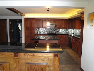 Remodeled kitchen with cherry cabinets and granite