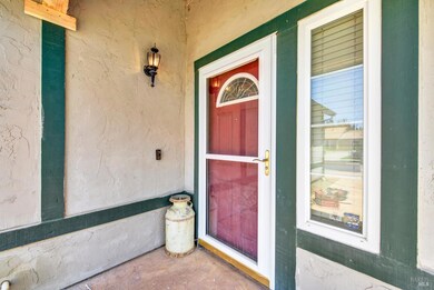 The front door has a newer glass security door to allow for more light to the entrance.