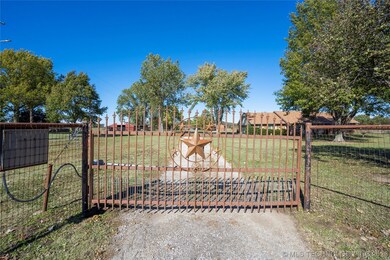 GATED and fully fenced 5 acres!