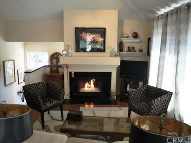 Cozy fire-and-ice gas fireplace in the living room - View #1
