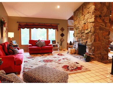 Formal living room with stone to ceiling see throu