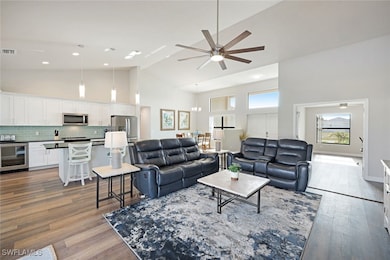 Living area featuring visible vents, dark wood-sty
