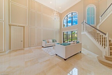 Formal living room showcasing custom wood trim. Al