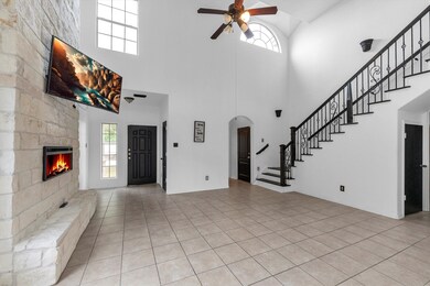 Main living area with high, two story ceiling.  Lo