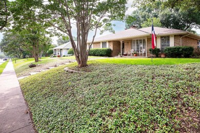 Single story home with a front lawn and a porch