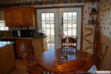 Eat in Kitchen area with a view through the french