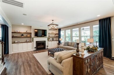 Light filled great room with gas fireplace, built-
