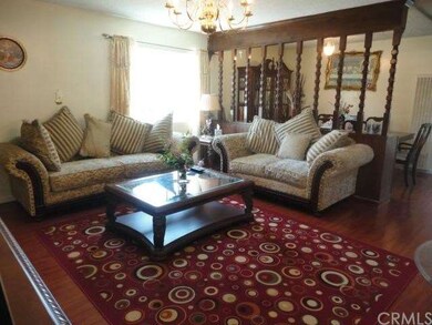 LIVING ROOM AND DINING BEHIND THE WOOD WORK.