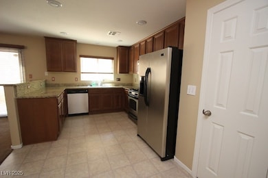 Kitchen with stainless steel appliances, a peninsu