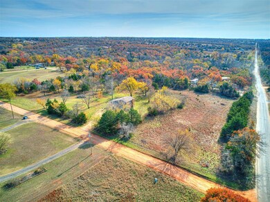 Birds eye view of property featuring a rural view
