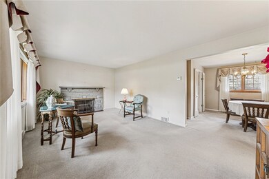 FRONT ENTRY INTO LIVING ROOM OVERLOOKING DINING