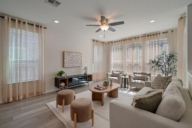 Living area featuring visible vents, recessed lig