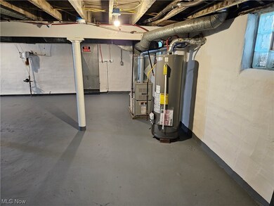 Basement featuring gas water heater