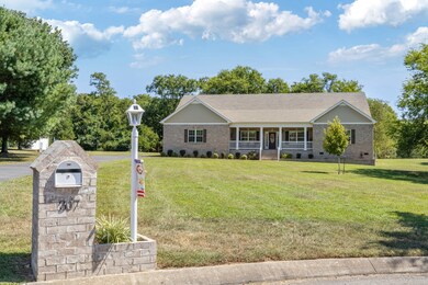 This home offers a security system, dusk to dawn lighting, solar walkway lighting and a brick garden wall was installed on the front right flower bed. The owner also built the brick mailbox and solar light.