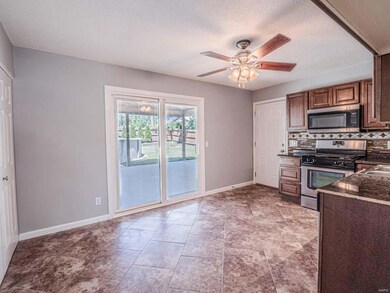 Sliding Doors to Entertaining Covered Patio Area. 