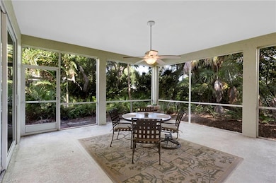 Oversized lanai surrounded by lush tropical landsc