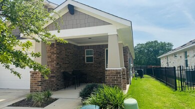 View of side of home with brick siding, a garage,