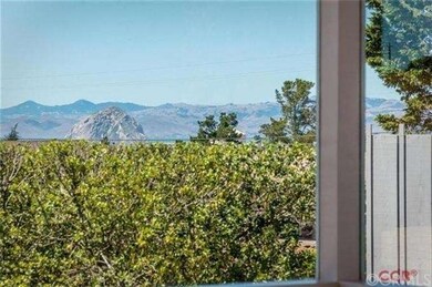 Views of Morro Rock and the ocean are seen through