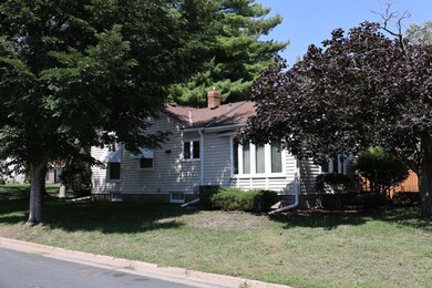 Corner lot. Notice bow-bay casement windows on side with 