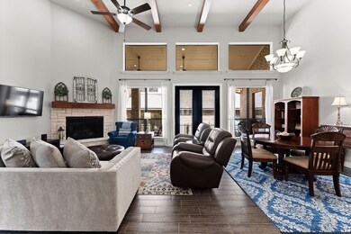 Open and airy floorplan with stone fireplace.