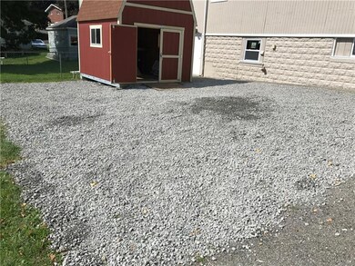 Parking for multiple cars - Shed with workbench an