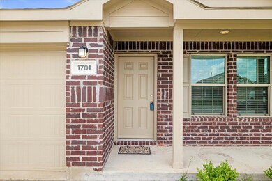 Entrance to property featuring a garage