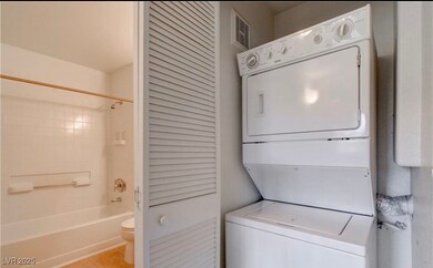 Laundry room with stacked washer / drying machine