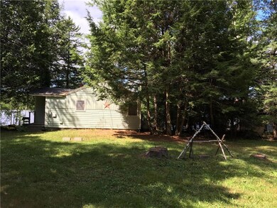 Side of home and yard with a glimpse...