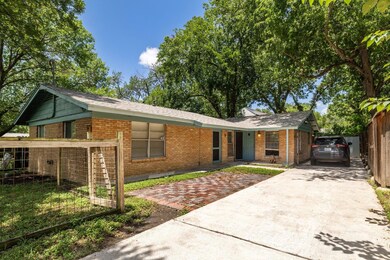 Single story home featuring concrete driveway and
