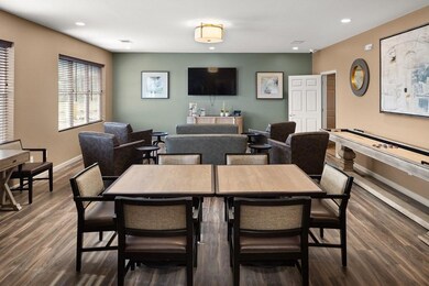 Dining room with dark hardwood / wood-style floors