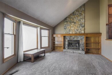 Stone Floor to Ceiling Fireplace