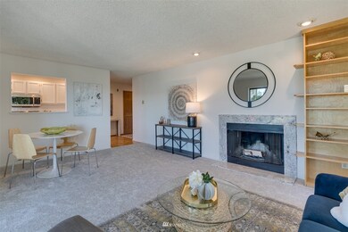 Large living room with wood burning stove and dining area.