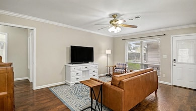 This living area offers great natural light from the large front window and provides a comfortable space for everyday living. Neutral tones make it easy to move right in and make it your own.
