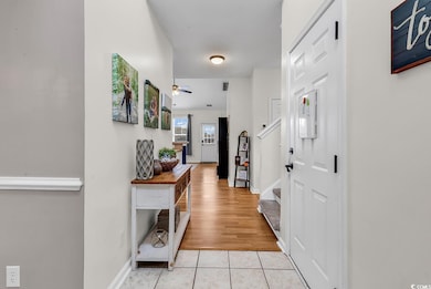 Foyer featuring light tile patterned floors, ceili