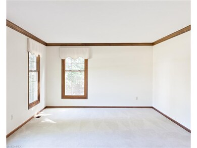 The spacious living room is graced by stately crow