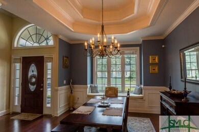 Dining room with double trey ceiling and window se